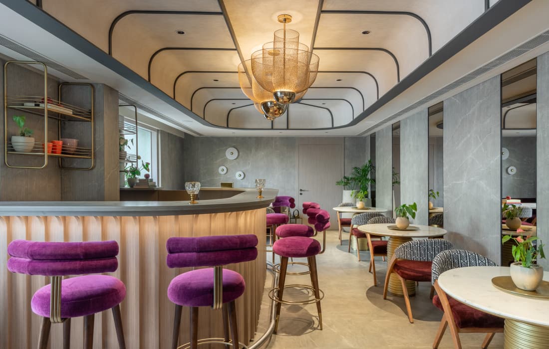 Cafe with cozy seating arrangements at Piramal Revanta